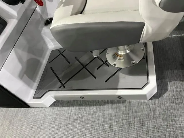 Slide: The Image of Captain's chair on 2025 Veranda VX 25 DCRC boat, featuring sleek design and modern flooring. - 16