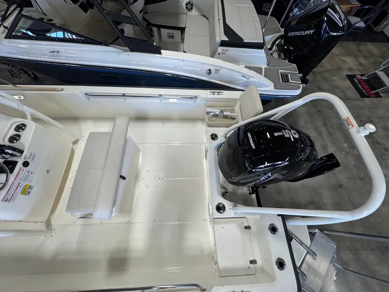 Slide: The Image of 2025 Boston Whaler 190 Montauk boat interior with Mercury outboard motor. - 3