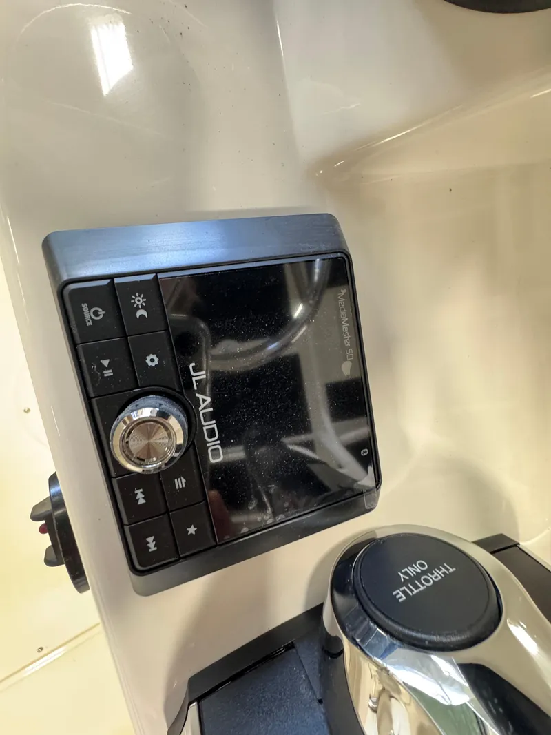 Slide: The Image of JL Audio system on 2025 Boston Whaler 190 Montauk boat dashboard. - 7