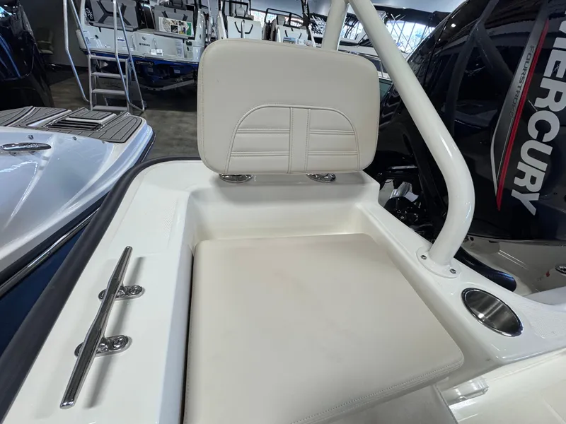Slide: The Image of 2025 Boston Whaler 190 Montauk boat seat with Mercury engine in showroom. - 9