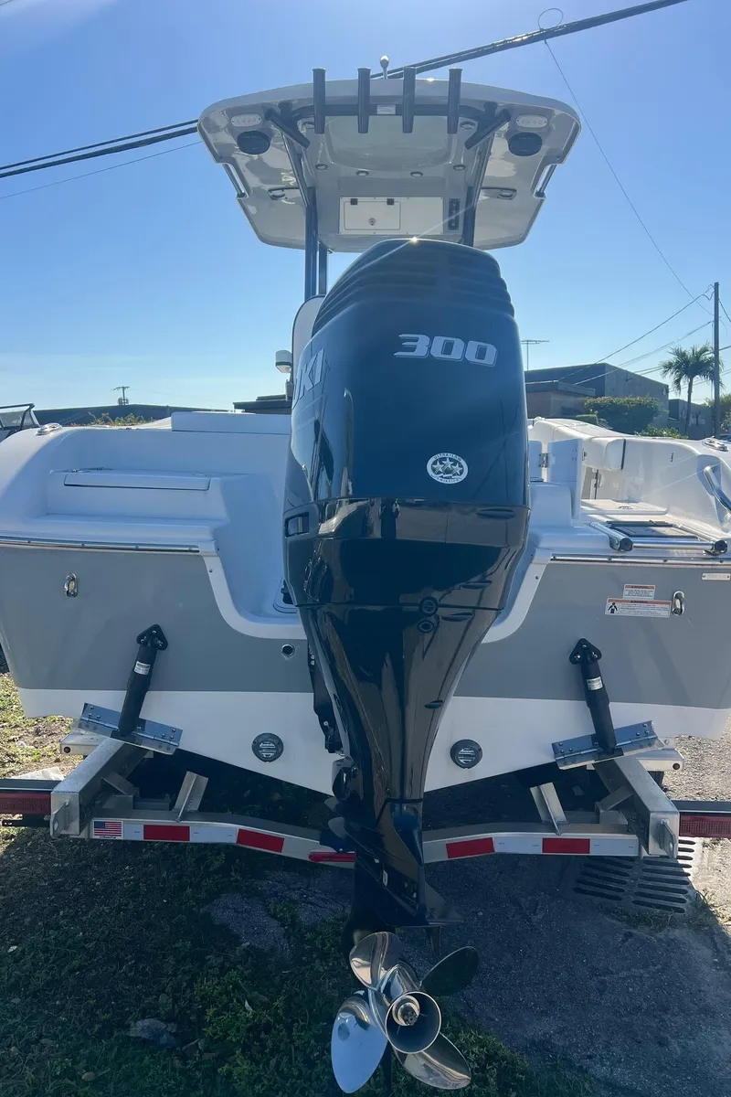 Slide: The Image of 2024 Sea Pro 242 DLX boat with 300 HP engine, rear view. - 3