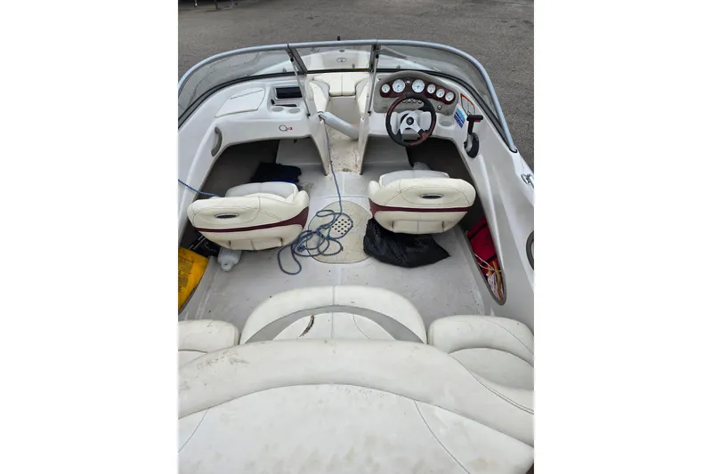 Slide: The Image of 2009 Tahoe Q4 SS boat interior with white seats and steering wheel. - 23