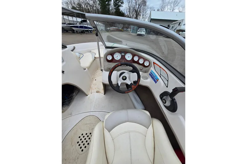 Slide: The Image of 2009 Tahoe Q4 SS boat interior with steering wheel and dashboard gauges. - 24