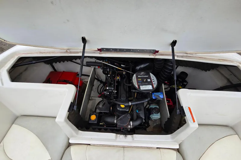 Slide: The Image of Open engine compartment of a 2009 Tahoe Q4 SS boat, showcasing the MerCruiser engine. - 25