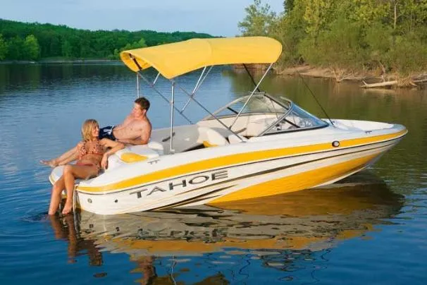 Slide: The Image of Manufacturer Provided Image: A colorful Bimini top supplies shade when needed. - 9