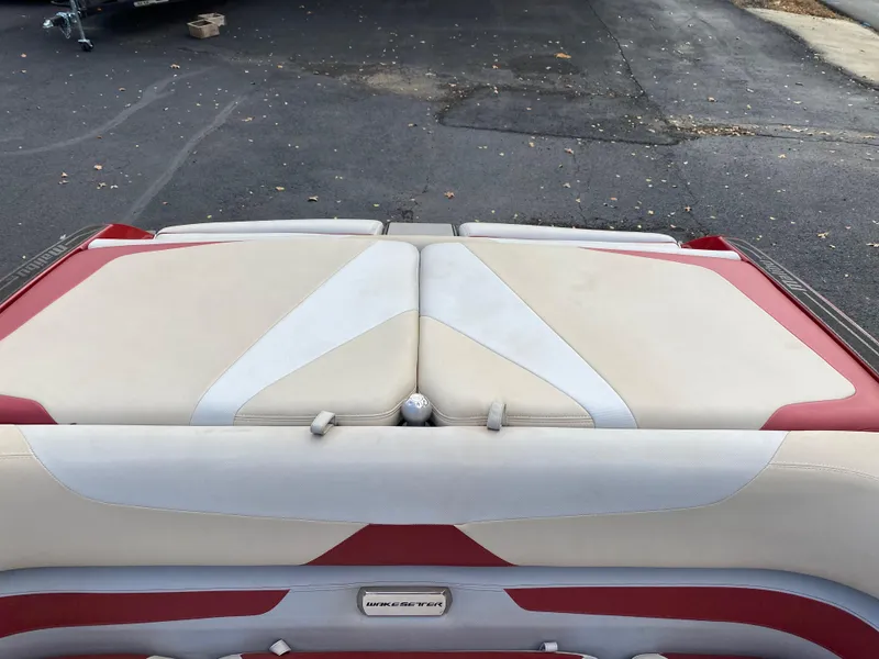 Slide: The Image of 2016 Malibu Wakesetter 23 LSV boat interior with red and white upholstery. - 14
