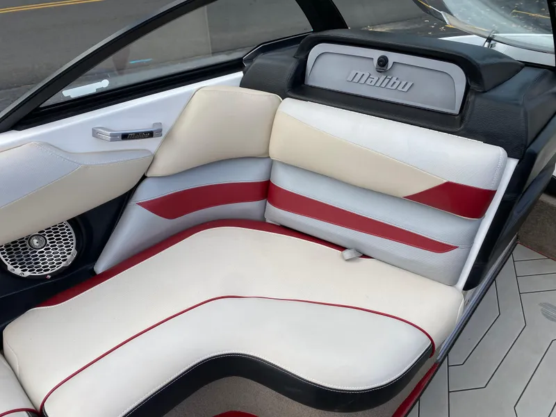Slide: The Image of 2016 Malibu Wakesetter 23 LSV interior with white and red seating. - 16