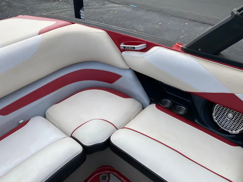 Slide: The Image of 2016 Malibu Wakesetter 23 LSV interior with red and white seating. - 20