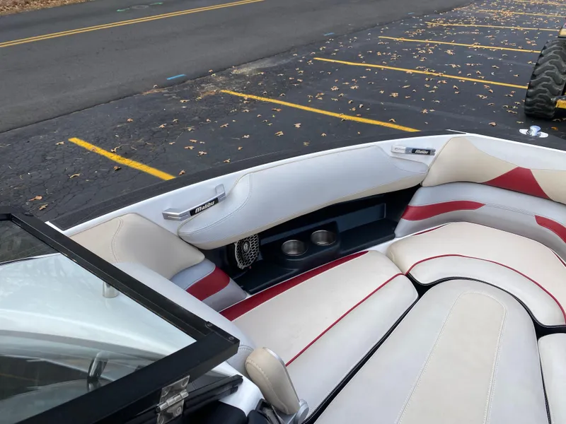Slide: The Image of 2016 Malibu Wakesetter 23 LSV boat interior with white and red seating. - 22