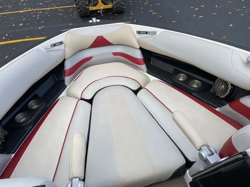Slide: The Image of 2016 Malibu Wakesetter 23 LSV boat interior with white and red seating. - 24