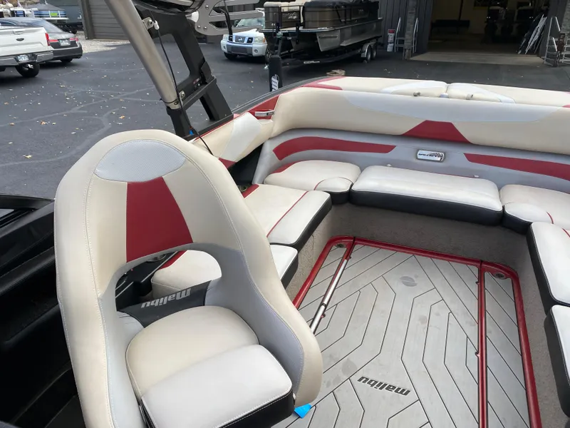 Slide: The Image of 2016 Malibu Wakesetter 23 LSV interior with red and white seating. - 25