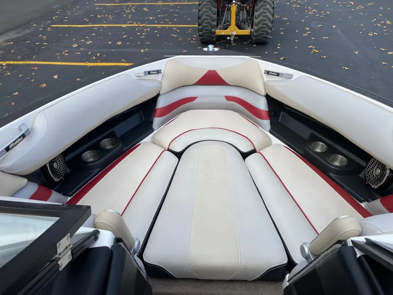 Slide: The Image of 2016 Malibu Wakesetter 23 LSV boat interior with white and red seating. - 28
