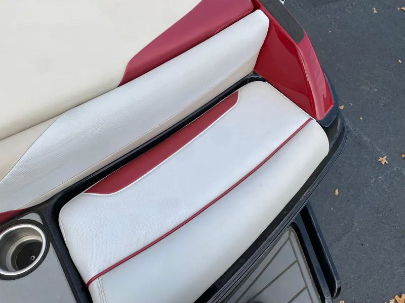 Slide: The Image of 2016 Malibu Wakesetter 23 LSV boat seat with red and white upholstery. - 8