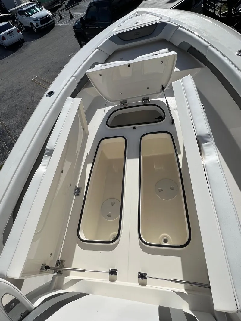 Slide: The Image of 2024 ShearWater 270 SS CAROLINA boat with open storage compartments. - 9