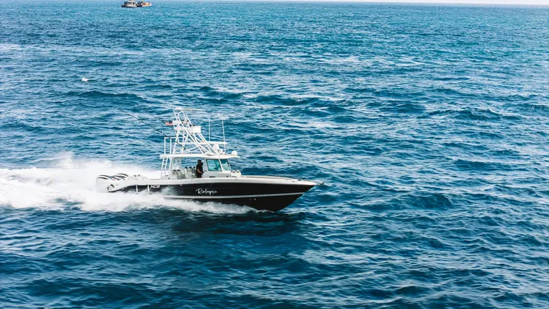 The Image of 2021 HCB 42 Lujo boat cruising swiftly on open ocean waters. - 1