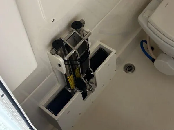 Slide: The Image of 2022 Boston Whaler 330 Outrage interior detail with marine equipment and drain. - 13