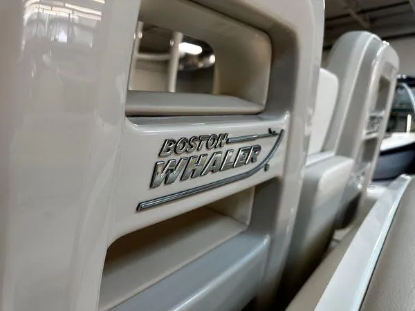 Slide: The Image of Close-up of 2022 Boston Whaler 330 Outrage logo on boat seat. - 19
