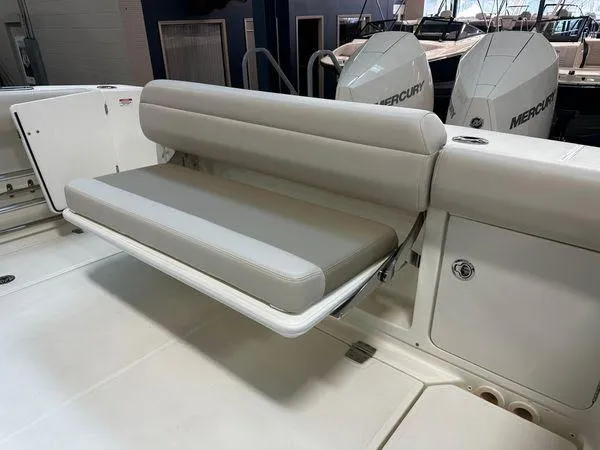 Slide: The Image of 2022 Boston Whaler 330 Outrage boat with foldable seating and Mercury engines. - 26