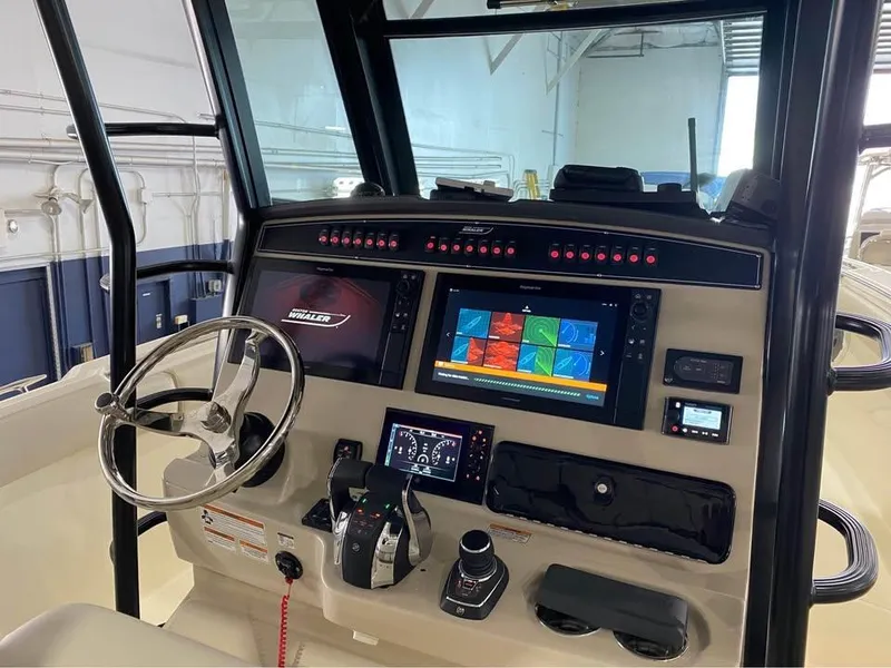 Slide: The Image of 2022 Boston Whaler 330 Outrage helm with advanced navigation system and controls. - 5