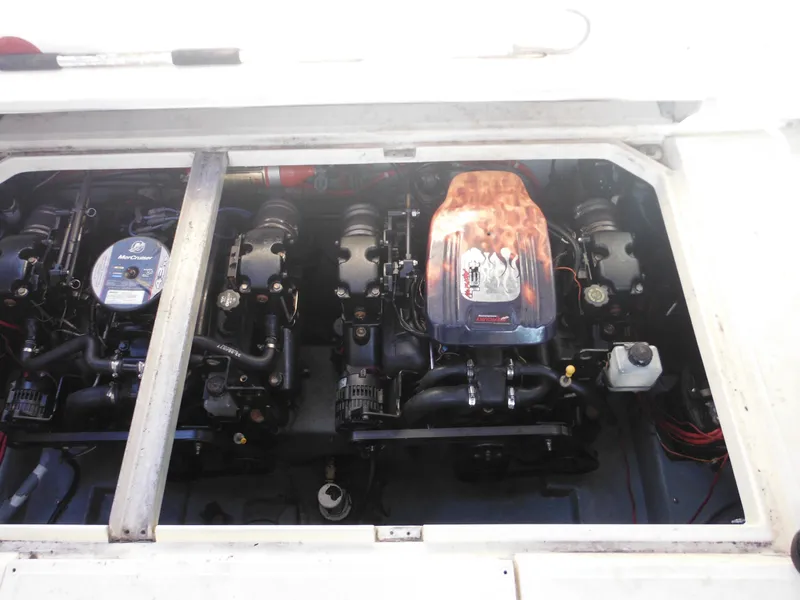 Slide: The Image of Engine compartment of 1988 Sea Ray 270 Sundancer boat, showcasing dual engines. - 25