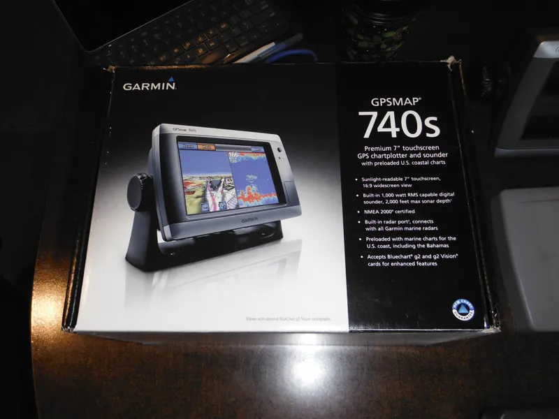 Slide: The Image of Garmin GPSMAP 740s box on a table, featuring a touchscreen GPS for Sea Ray 270 Sundancer. - 33