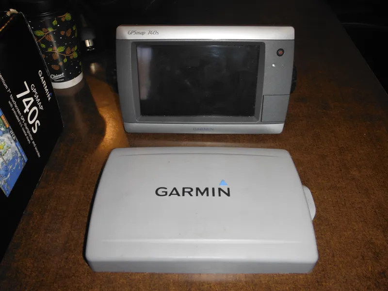 Slide: The Image of Garmin GPSmap 740s marine navigation system on a table, compatible with Sea Ray 270 Sundancer. - 34