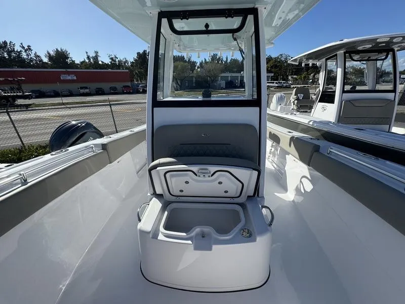 Slide: The Image of 2025 Sportsman Open 252 boat interior with seating and storage compartment. - 11