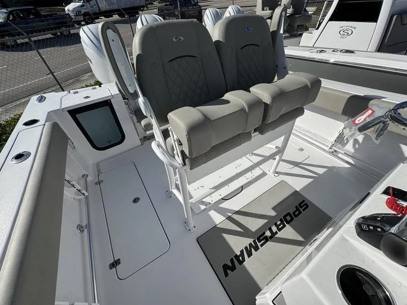 Slide: The Image of 2025 Sportsman Open 252 boat interior with cushioned seating and branded mat. - 20