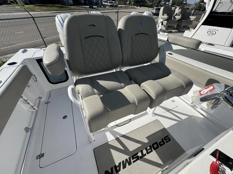 Slide: The Image of 2025 Sportsman Open 252 boat seating with cushioned dual seats and armrest. - 22
