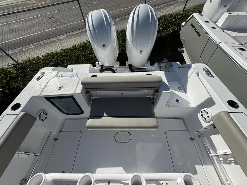 Slide: The Image of 2025 Sportsman Open 252 boat interior with dual engines and seating area. - 24
