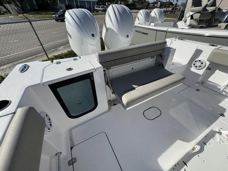 Slide: The Image of 2025 Sportsman Open 252 boat interior with seating and triple outboard engines. - 25