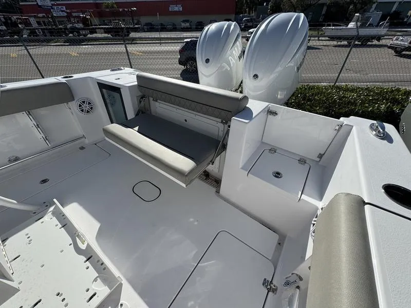 Slide: The Image of 2025 Sportsman Open 252 boat interior with seating and dual engines. - 26