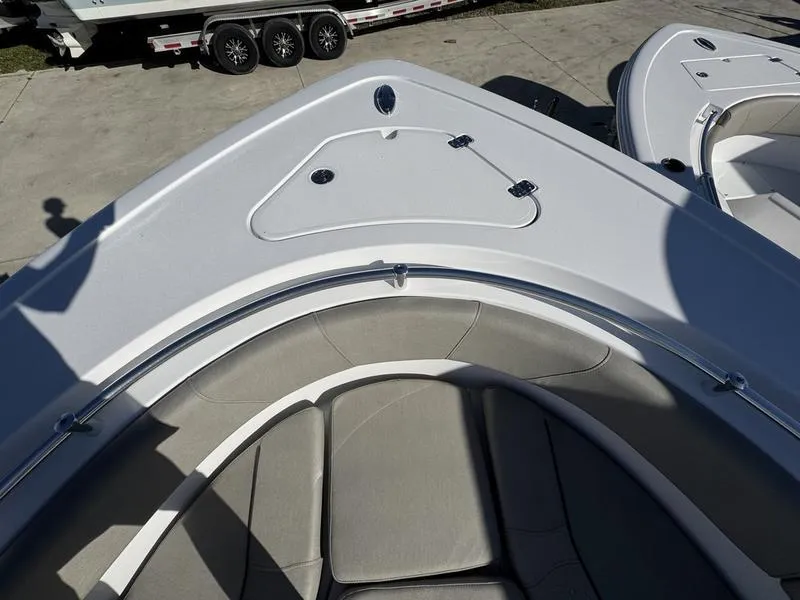 Slide: The Image of 2025 Sportsman Open 252 boat bow with seating and storage compartments. - 4