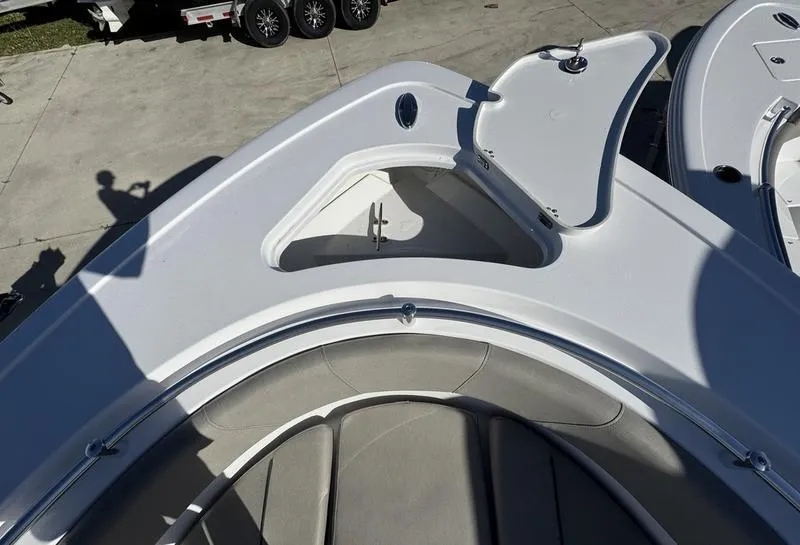 Slide: The Image of 2025 Sportsman Open 252 boat bow with open storage compartment. - 5