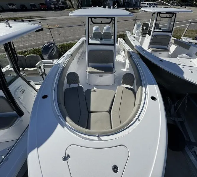 Slide: The Image of 2025 Sportsman Open 252 boat with spacious seating and modern design. - 8