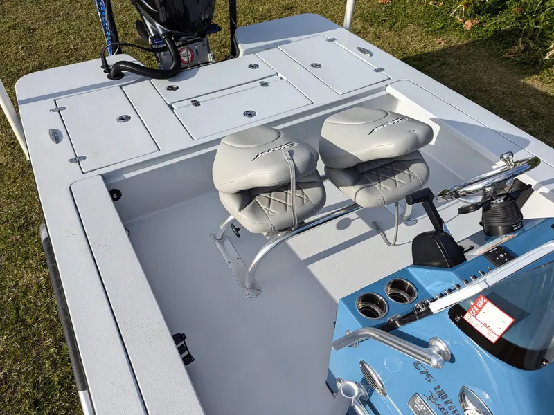 Slide: The Image of 2024 Blazer 675 Ultimate Bay boat interior with dual seats and control panel. - 11