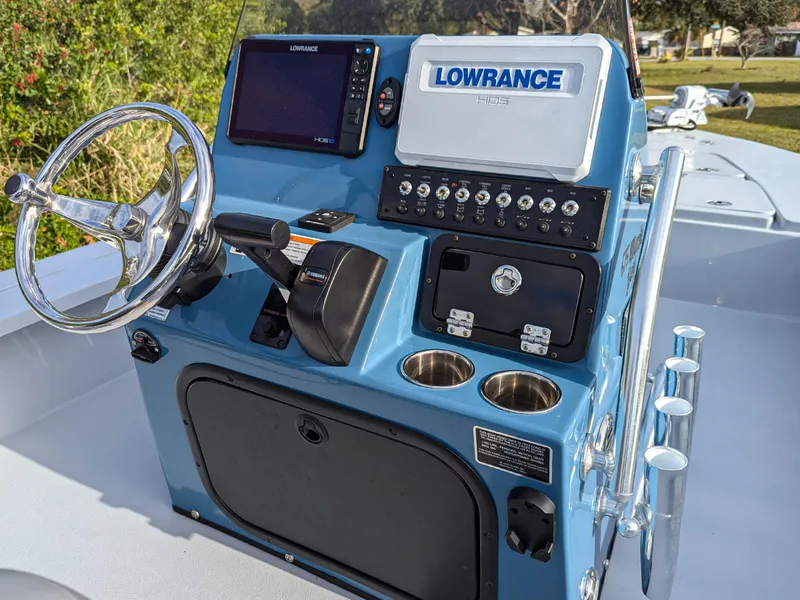 Slide: The Image of 2024 Blazer 675 Ultimate Bay boat console with Lowrance electronics and steering wheel. - 7