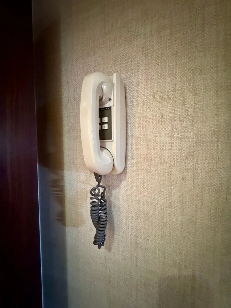 Slide: The Image of Vintage wall-mounted phone on 1984 Hatteras Motor Yacht interior. - 23