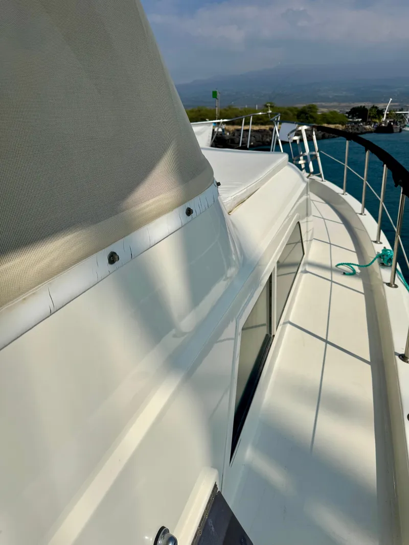 Slide: The Image of 1984 Hatteras Motor Yacht deck with ocean view and railing. - 5