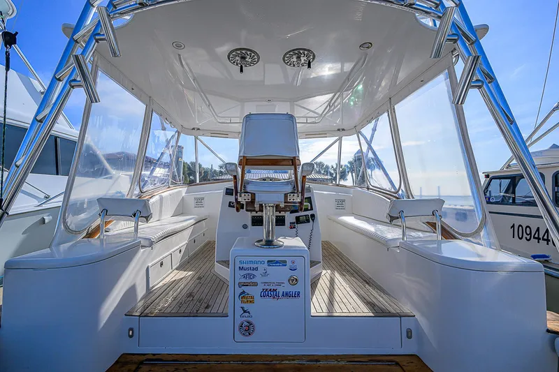 Slide: The Image of 2008 Jersey Cape Devil 36 boat interior with seating and helm station. - 10