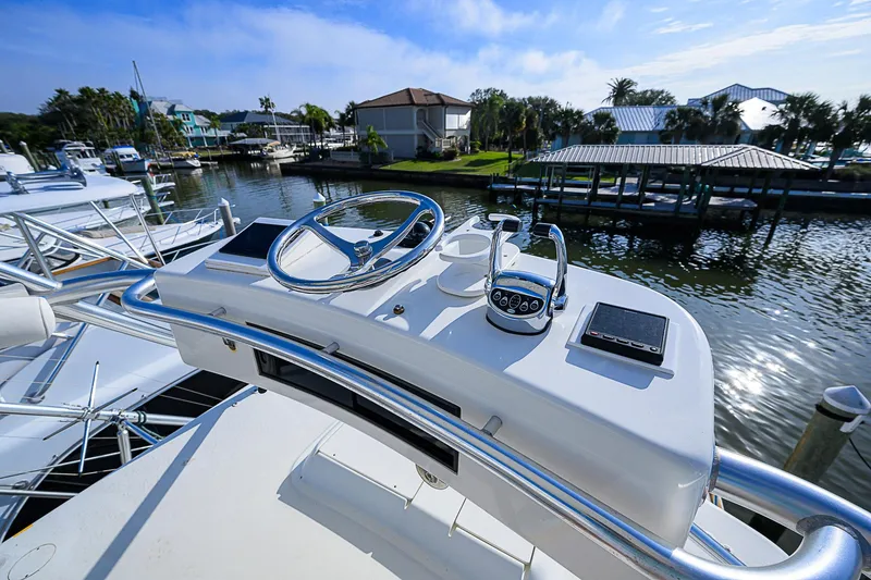Slide: The Image of Jersey Cape Devil 36 yacht helm, 2008 model, docked in a scenic marina. - 11