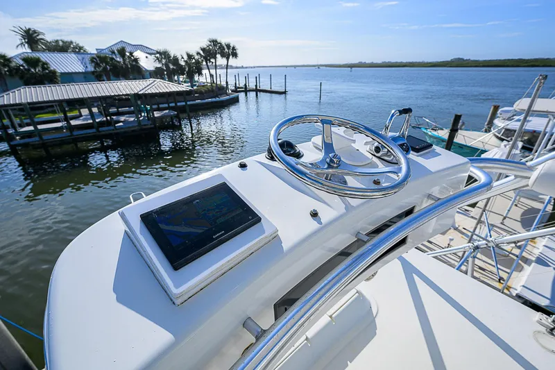 Slide: The Image of 2008 Jersey Cape Devil 36 boat helm with scenic waterfront view. - 13