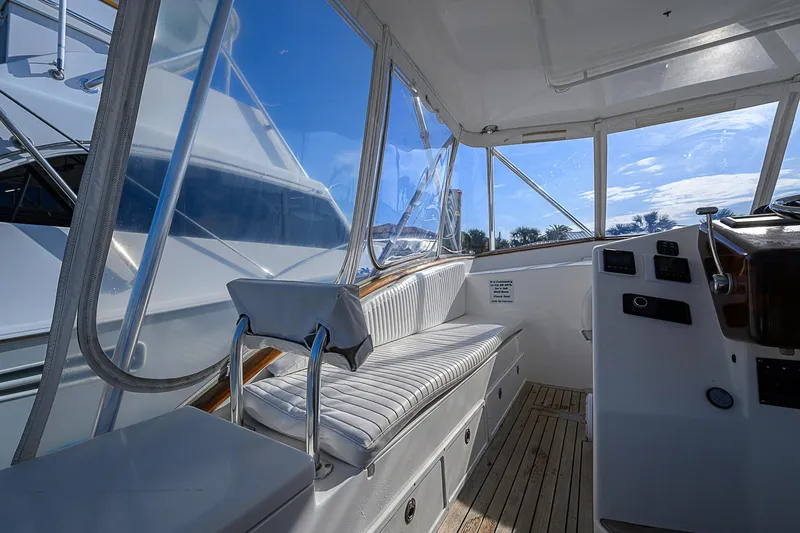 Slide: The Image of 2008 Jersey Cape Devil 36 boat interior with seating and controls. - 19