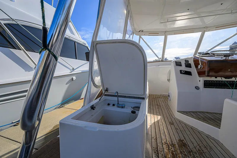 Slide: The Image of 2008 Jersey Cape Devil 36 boat interior with open hatch and wooden deck. - 20