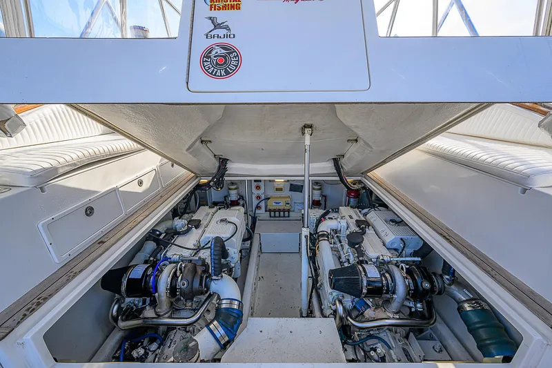 Slide: The Image of Engine compartment of 2008 Jersey Cape Devil 36 boat, showcasing dual engines. - 25