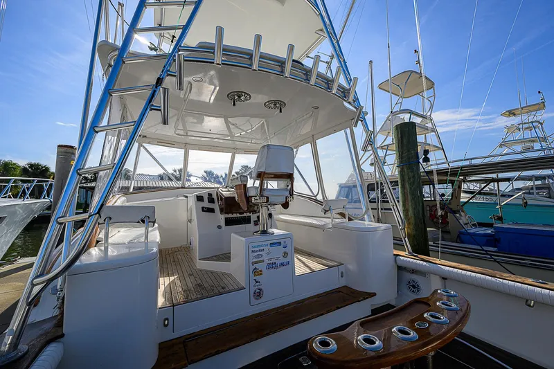 Slide: The Image of 2008 Jersey Cape Devil 36 boat docked, featuring spacious deck and fishing equipment. - 29