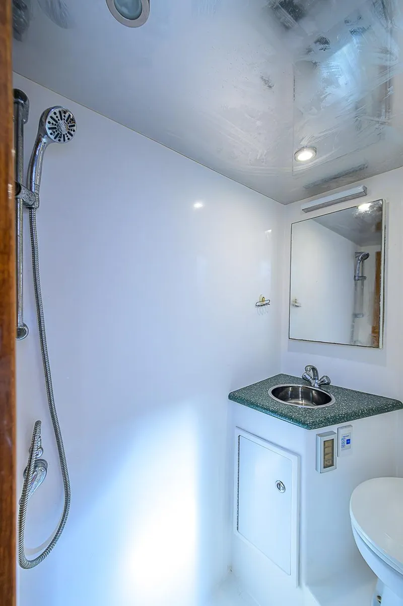 Slide: The Image of 2008 Jersey Cape Devil 36 yacht bathroom with shower and sink. - 36