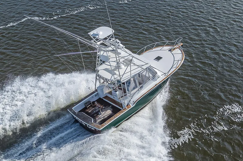 Slide: The Image of 2008 Jersey Cape Devil 36 boat cruising on open water. - 37