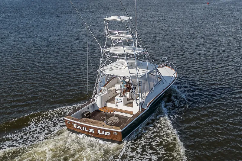 Slide: The Image of 2008 Jersey Cape Devil 36 boat cruising on open water, rear view. - 4