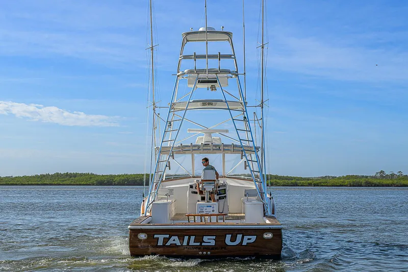 Slide: The Image of 2008 Jersey Cape Devil 36 boat on water, rear view with "Tails Up" name. - 7